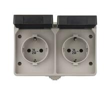 Pistikupesa EMOS A1396.1, 2-kohaline, pinnapealne, maandusega, IP44, 16A/250V, valge, musta kaanega